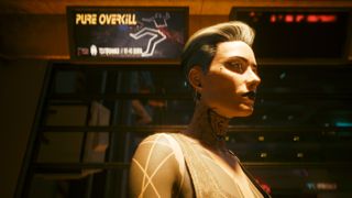 Cyberpunk 2077 screenshot showing a woman with short white hair, facial piercings, and full body tattooes standing beneath a warm light