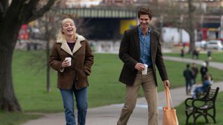 Florence Pugh and Andrew Garfield's characters taking a stroll in comedy-drama We Live in Time
